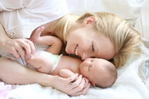 Mother holding baby after giving birth