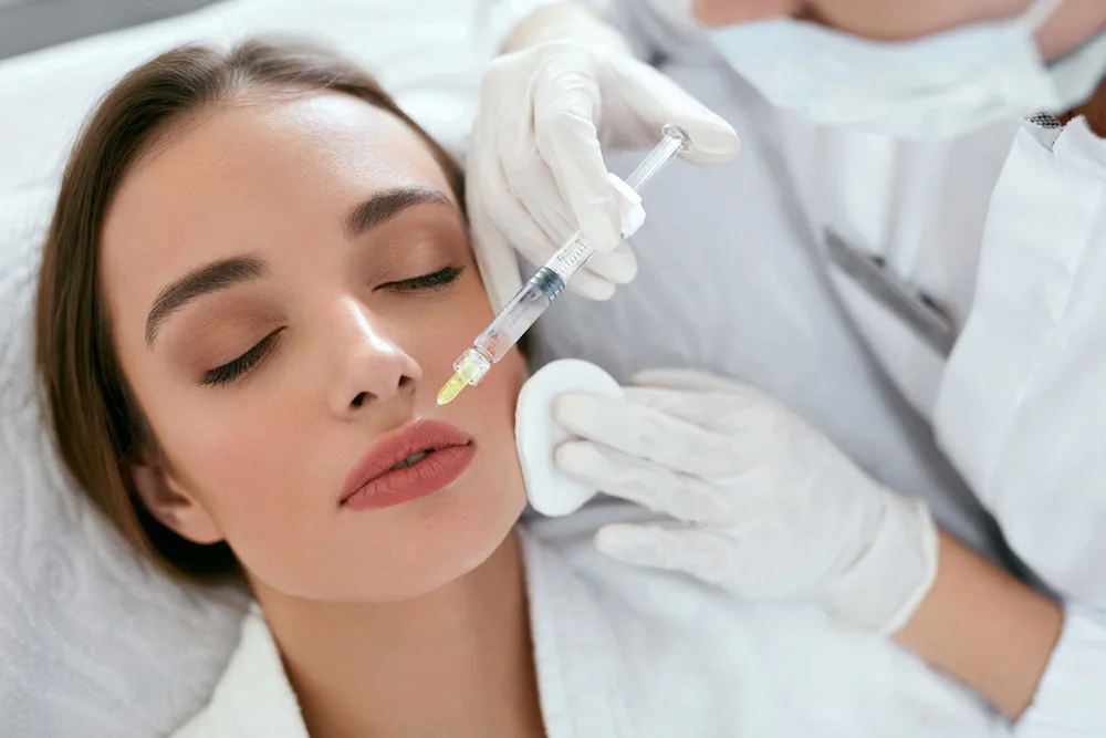 woman at the doctor's office getting lip filler