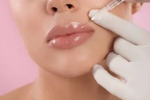 Woman getting lip fillers to not use lip plumping gloss anymore