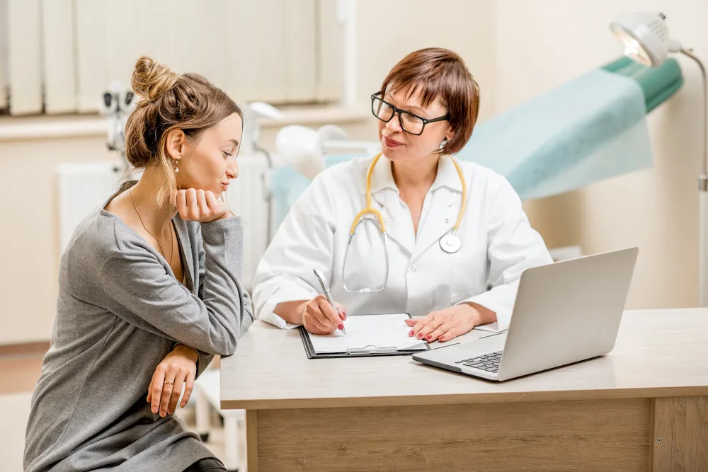 Woman talking to a doctor about her treatment options for a Bartholin Cyst