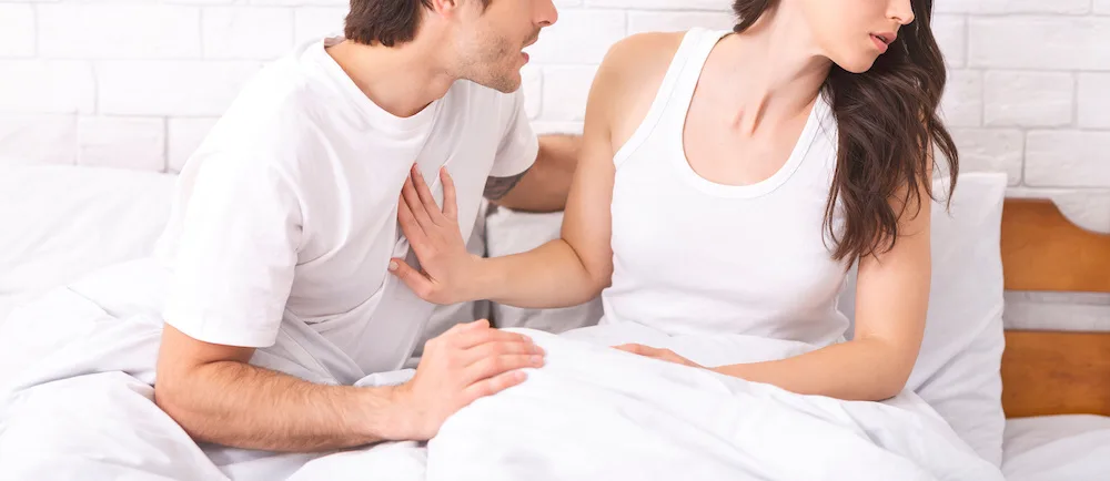 woman with vaginal discomfort refusing sex with her partner because of the discomfort