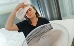 woman with hormone imbalances having a hot flash