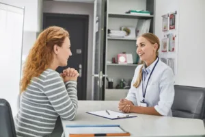 Female doctor speaking with new client to determine which treatment is right for her.