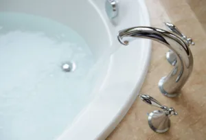 woman setting up a bath for her bartholin cyst treatment
