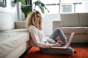 A woman researching information about potential treatments and procedures.