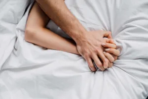Licensed Save to Library Preview Crop Find Similar FILE #: 328317578 Top view of woman holding hand of boyfriend on bed.