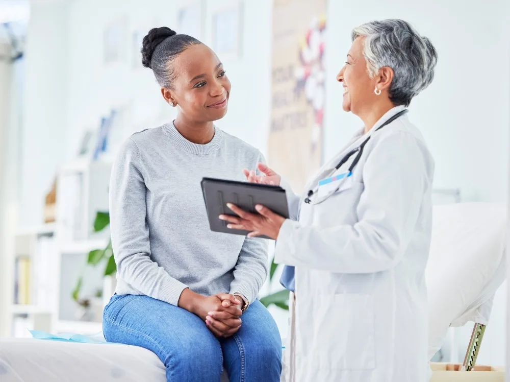 A doctor speaking to her patient about whether or not a treatment is right for her.