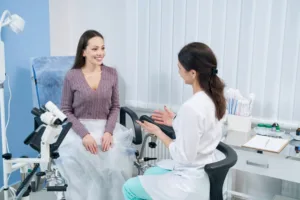 A woman speaking to her surgeon about a gynecology procedure.