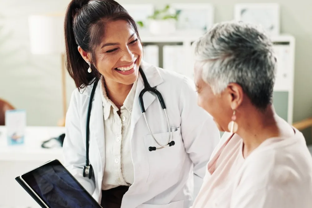 A woman speaking to her doctor about a potential cosmetic prodecure.