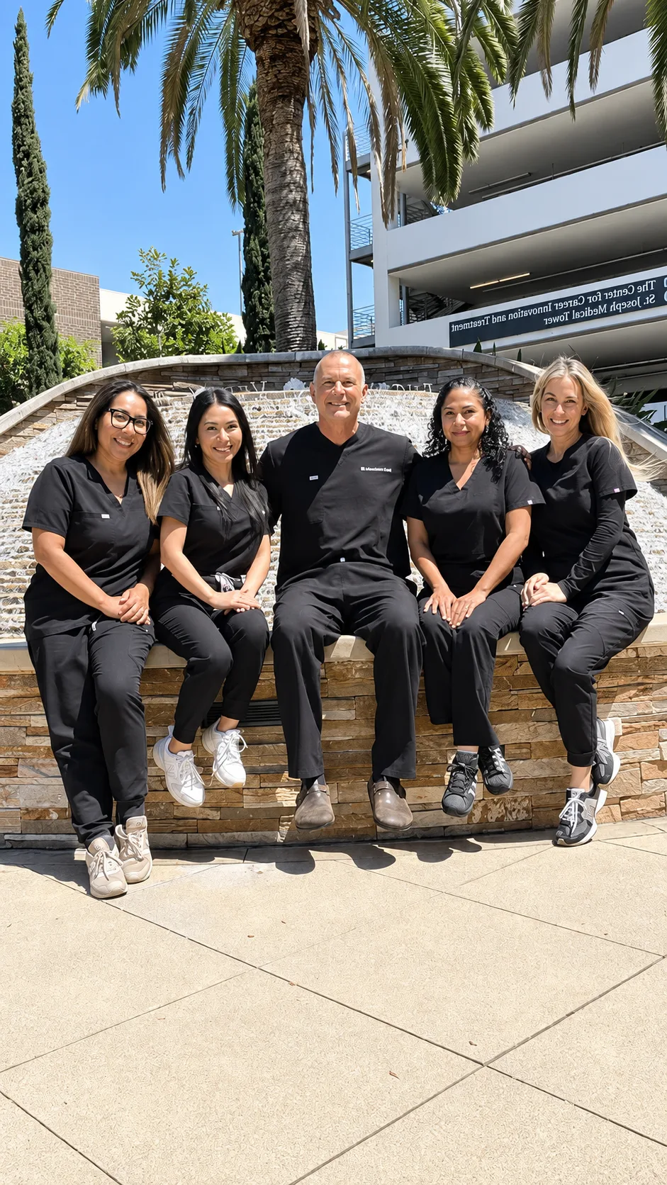 Dr. David Ghozland with the Intimate Health Center care team outside the St. Joseph Medical Tower